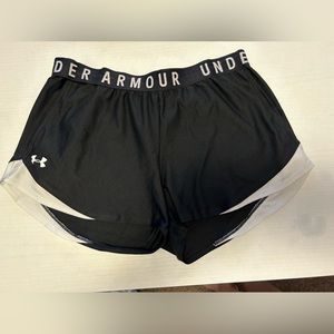 Large Under Armour float shorts with pockets and logo waistband.